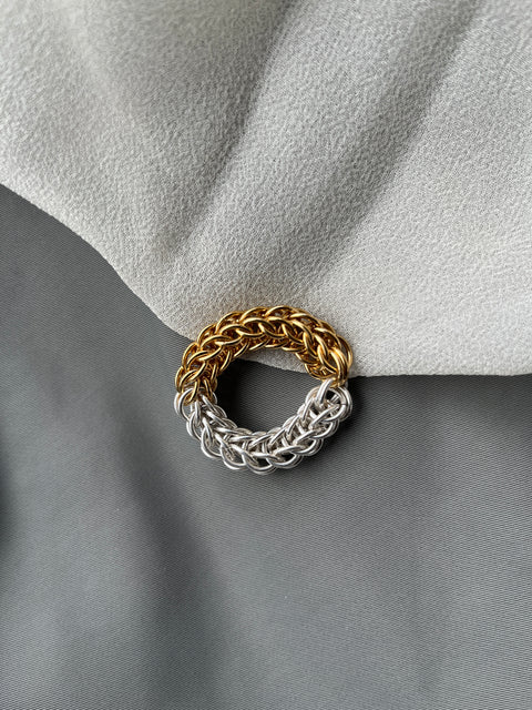 a mix of silver and gold woven ring