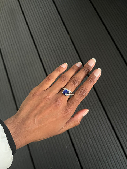 silver ring with lapis lazuli worn on the finger