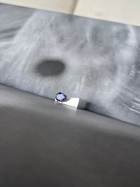 Iolite gemstone close-up showing deep blue and violet reflections